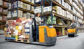 Woman Carrying Pallets in a Factory with an ECE 227